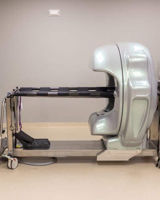 A medical machine is positioned on a table in a clinical room